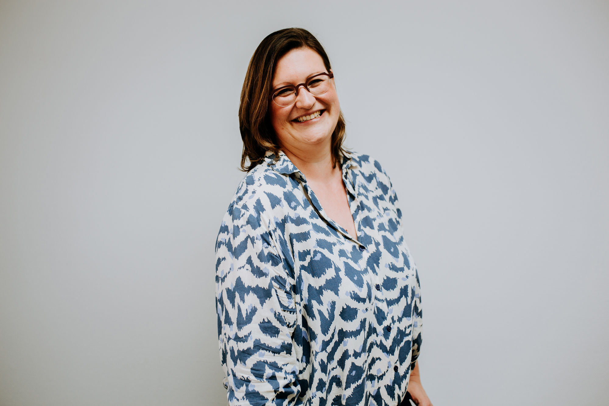 Executive communication coach Ellen Bracquine looking at the camera with a broad smile